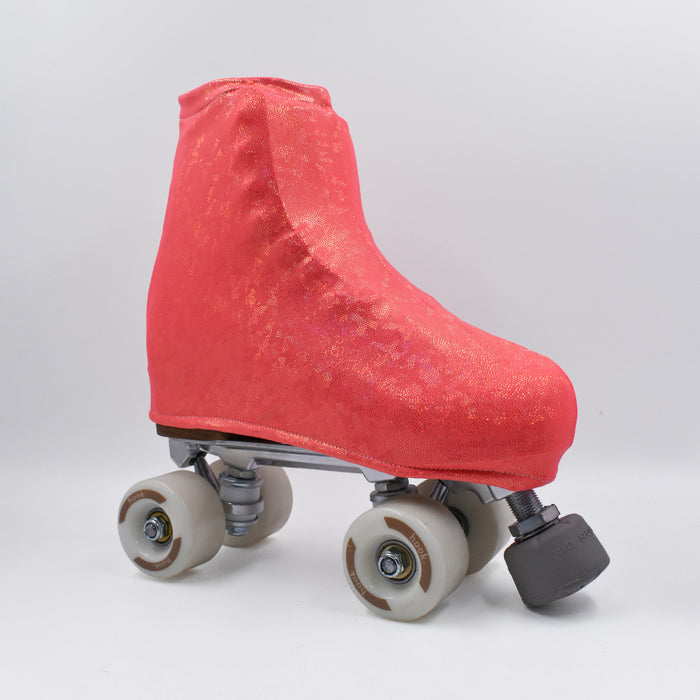 Cubre patines Hook coral brillante sobre un patín quad, vista lateral