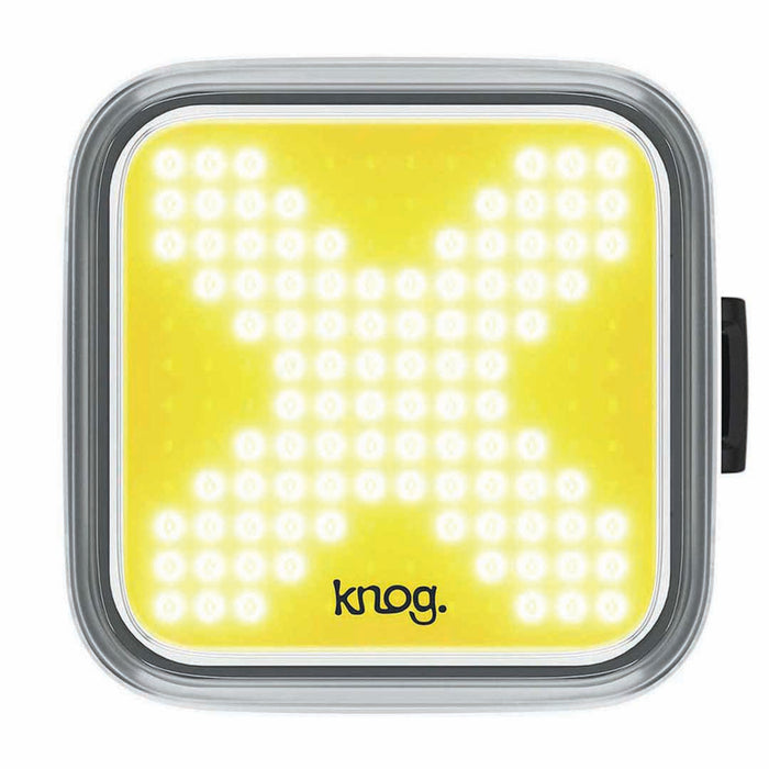 Luz delantera Knog Blinder X con diseño de X encendida